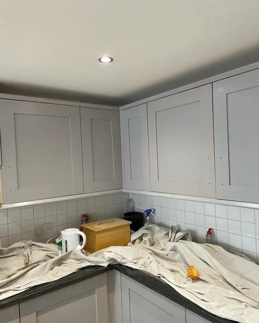 Grey shaker kitchen units and white metro splashback during a kitchen fitting project by our installation team.
